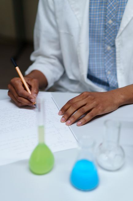 University researcher reviewing academic papers and journals with AI assistance