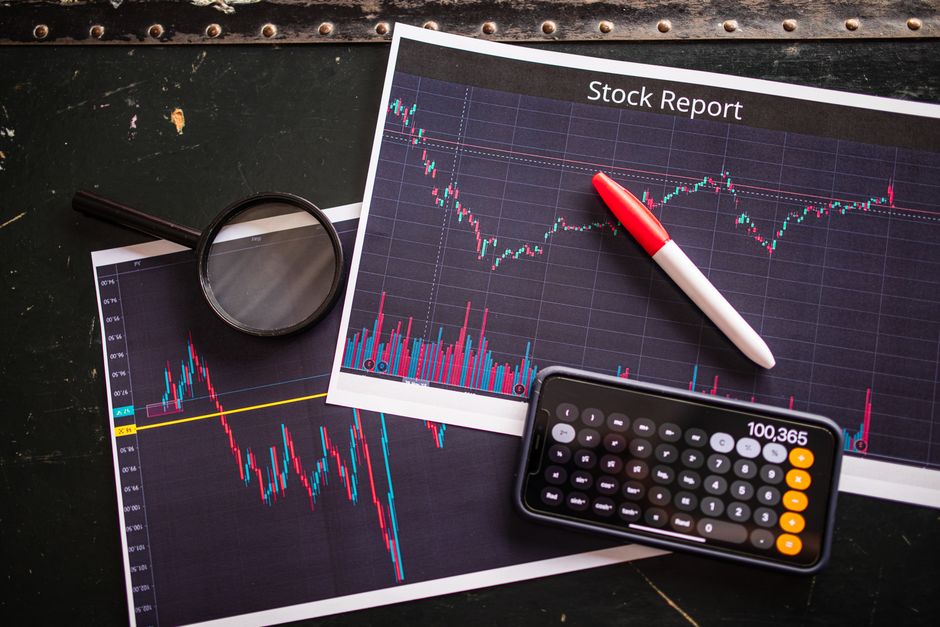 Stock market screens showing financial charts and data