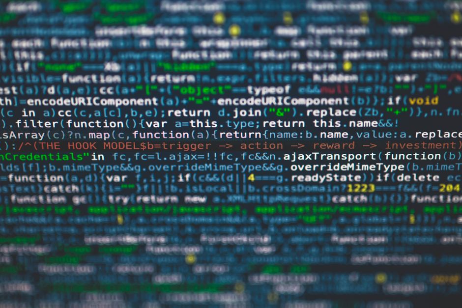 Software developer writing code to integrate an AI API on a dark terminal
