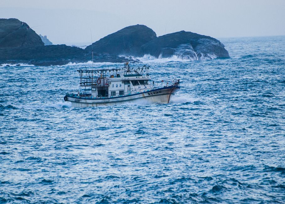 Small fishing boat on open ocean waters