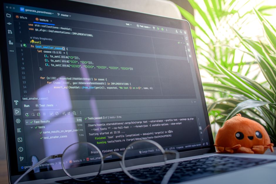 Developer using GitHub Copilot on a laptop in a modern workspace