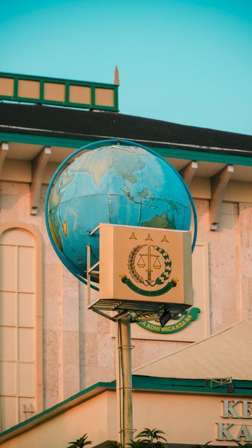 Globe with policy document representing global digital regulation