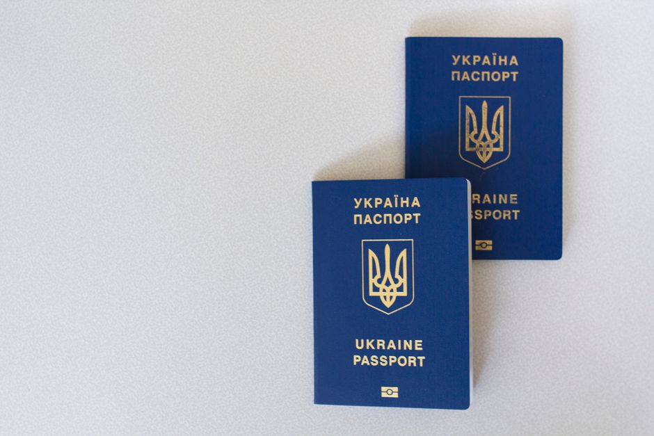 Government-issued passport and identity document on a secure verification screen