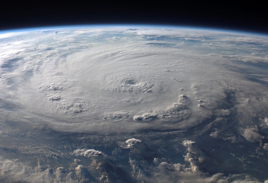 Scientists studying planetary atmospheric data on large screens