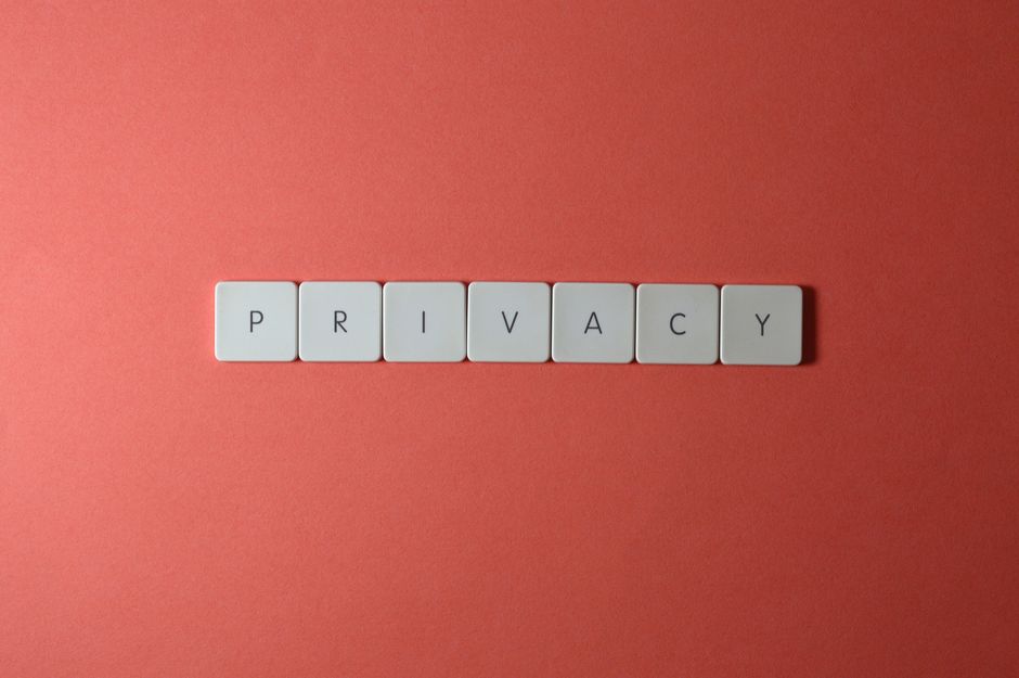 Person holding a phone with a privacy lock icon