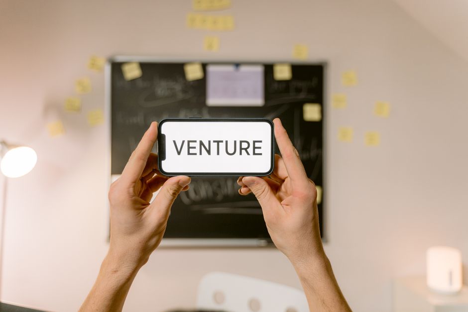 Young entrepreneurs working on AI startup ideas in a modern office