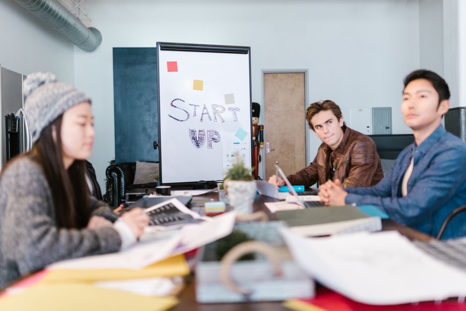 Diverse startup team presenting to venture capital investors