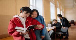 student-reading-book-university-educatio