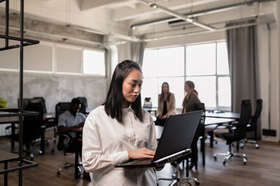 Business team using AI tools collaboratively in a modern open office environment