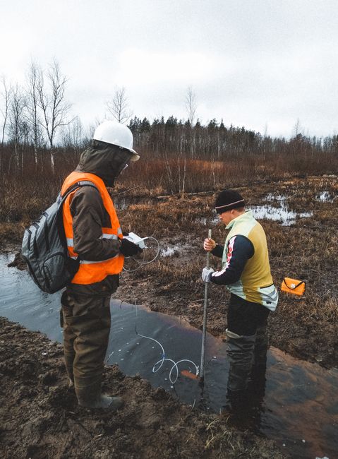 Environmental scientist testing water samples outdoors