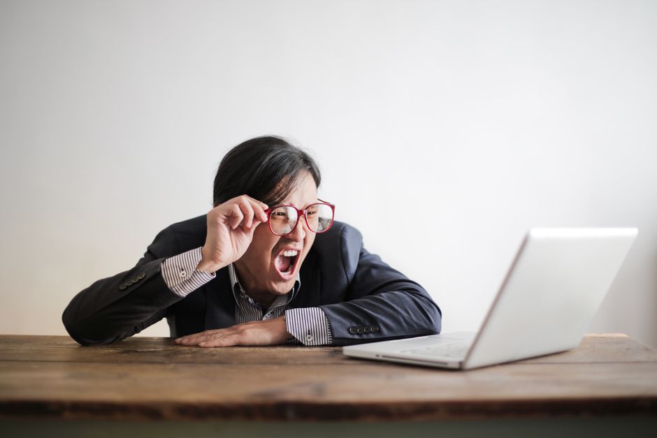 Person waiting on a slow laptop