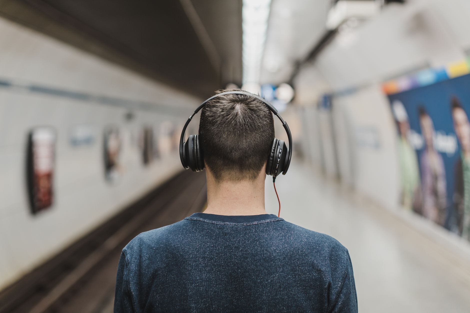 Person listening to music while walking in a city