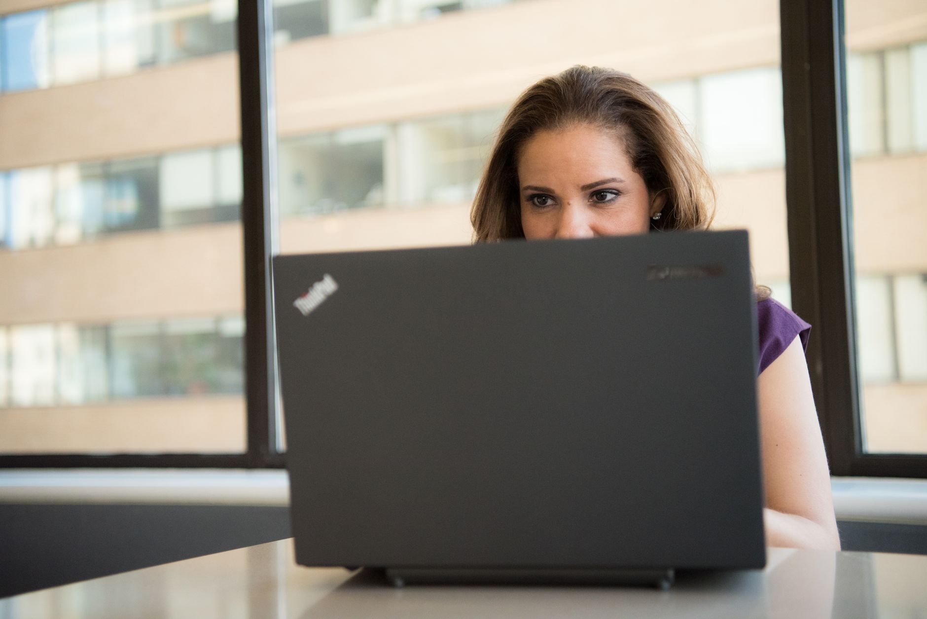 Person comparing AI assistants on a laptop