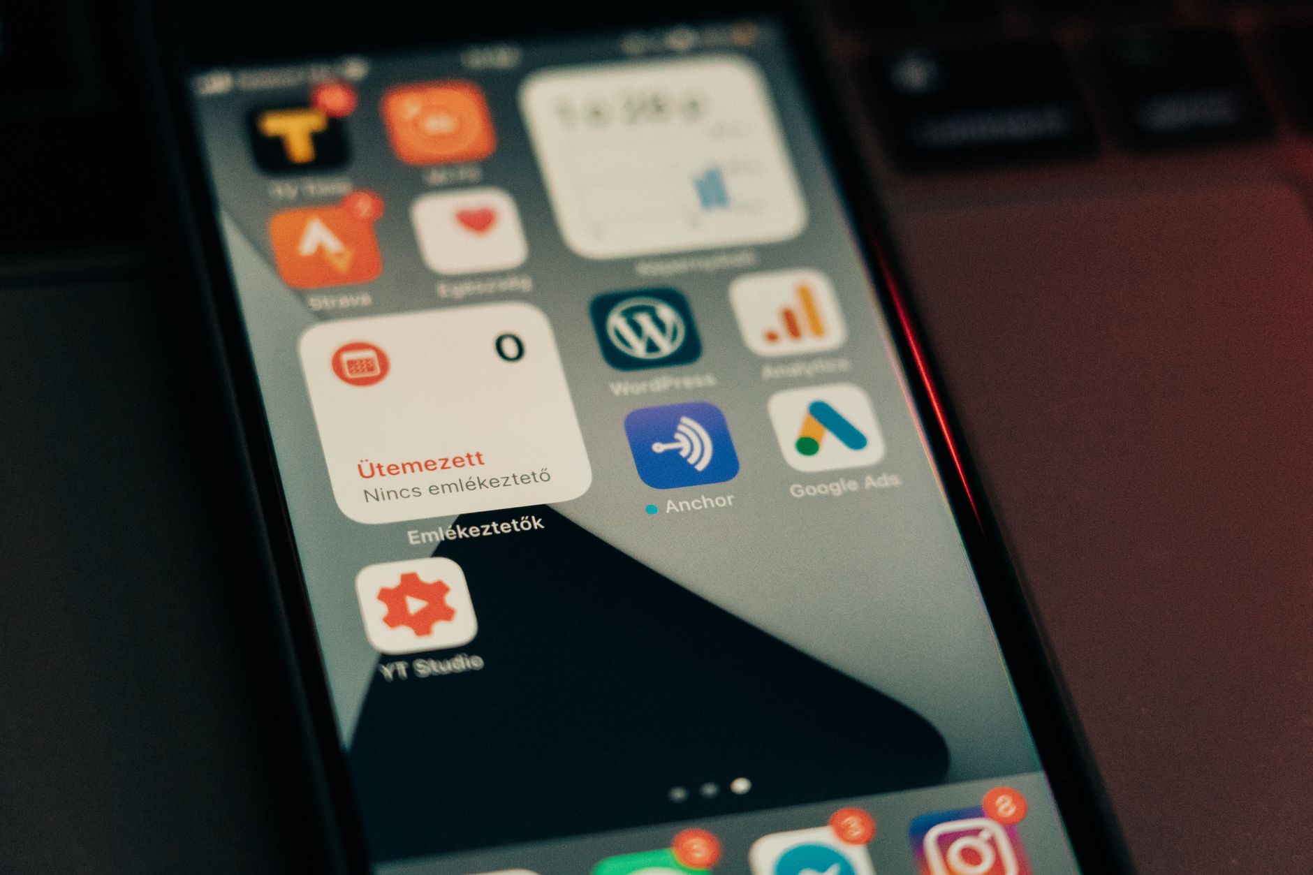 Person holding a smartphone showing an app interface